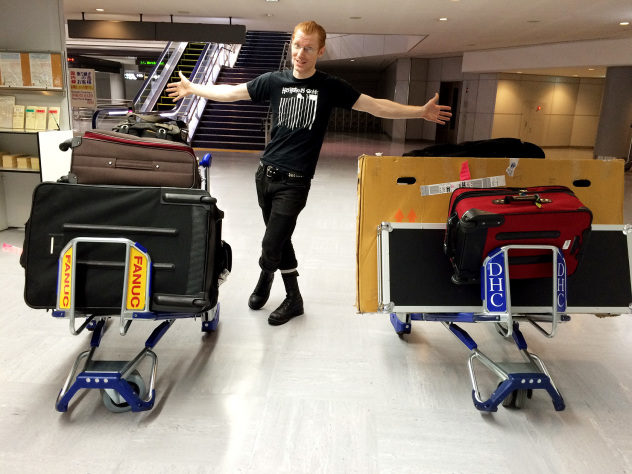 Peter posing with way too much luggage in Narita Airport