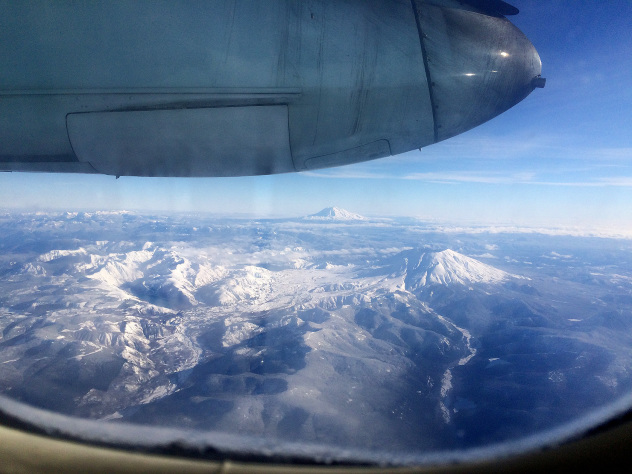 Wreathed in snow and propeller noise, Washington's beautiful snow-capped volcanoes scrolled by.